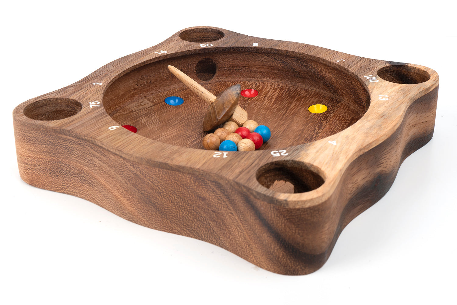 Wooden game board with darts and colored markers on a white background