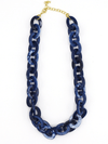 Navy blue resin chain link necklace by Fair Anita, bold chunky style with white marbled pattern