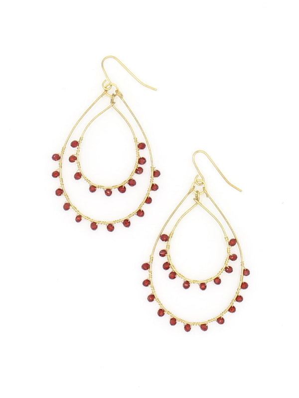 Rubi Sparkle Earrings – oversized double open teardrop earrings with red glass beads in brass by Fair Anita