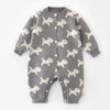 Gray baby onesie with white dog pattern on a white background