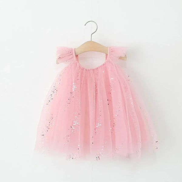 Child wearing the Sparkle Princess Dress by Ryan and Remi