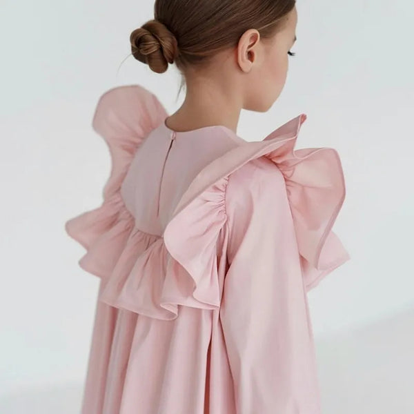 Pink dress with ruffled sleeves on a white background