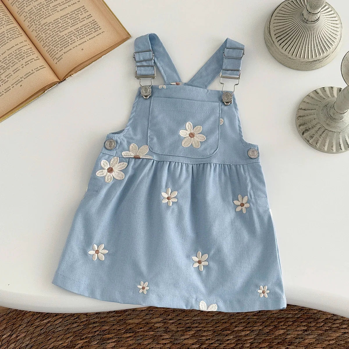 Close-up of floral embroidery detail on the Blue Flower Embroidery Dress