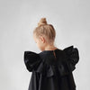 Flying Sleeve Ruffle Dress styled as a gift-ready outfit for kids