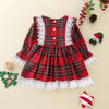 Baby wearing the Plaid Christmas Flare Dress by Ryan and Remi