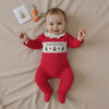 Baby wearing the Polka Dot Christmas Tree Romper