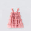 Pink ruffled dress on a light gray background