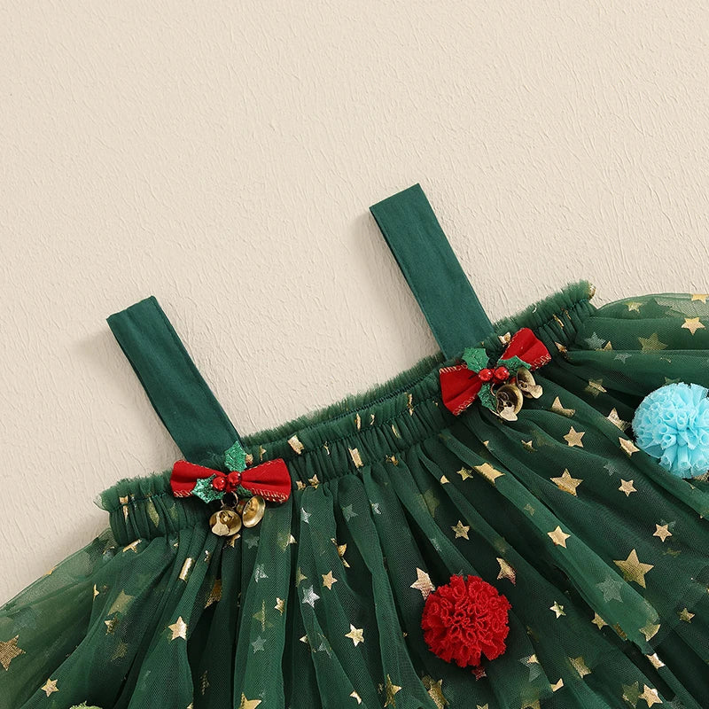 Green dress with red bows and pom-poms on a beige background