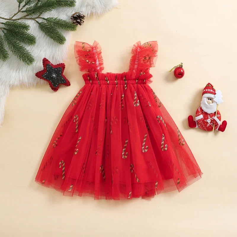 Red tulle dress with Christmas decorations on a beige background