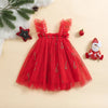 Red tulle dress with Christmas decorations on a beige background