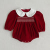 Baby wearing the Festive Vintage Style Romper