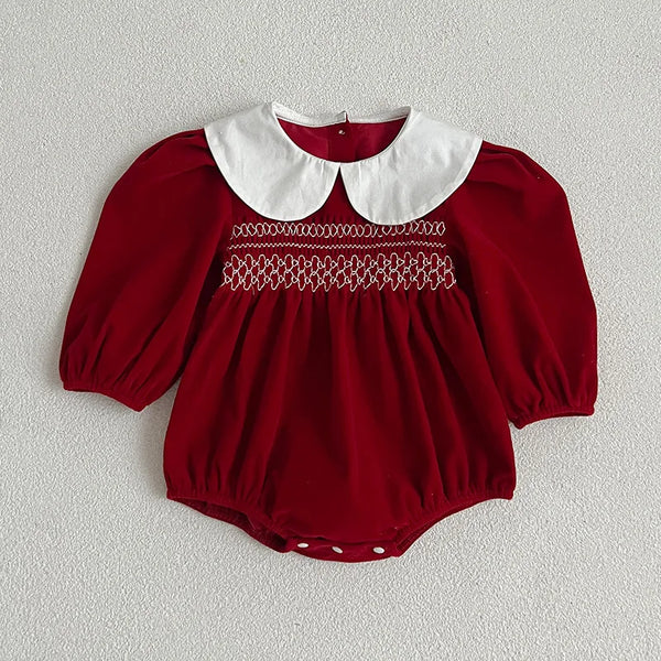 Baby wearing the Festive Vintage Style Romper
