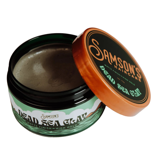 Sampson's hair product jar with open lid on a white background