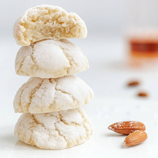Stack of four almond cookies with almonds on a light background. Indulge in Andy Anand’s 20-piece Sugar-Free Amaretti Cookies. Handcrafted in Sicily using a 200-year-old recipe, these gluten-free almond treats feature four delicious flavors. The perfect diabetic-friendly gift for any celebration!
