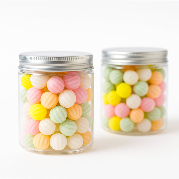 Two jars filled with colorful round candies on a white background. Discover Andy Anand’s 220-piece Sugar-Free Spiral Candy. Handmade in Spain and naturally sweetened with Stevia, these vegan and gluten-free hard candies are perfect for diabetics. Enjoy five delicious flavors in one guilt-free, tooth-friendly gift!