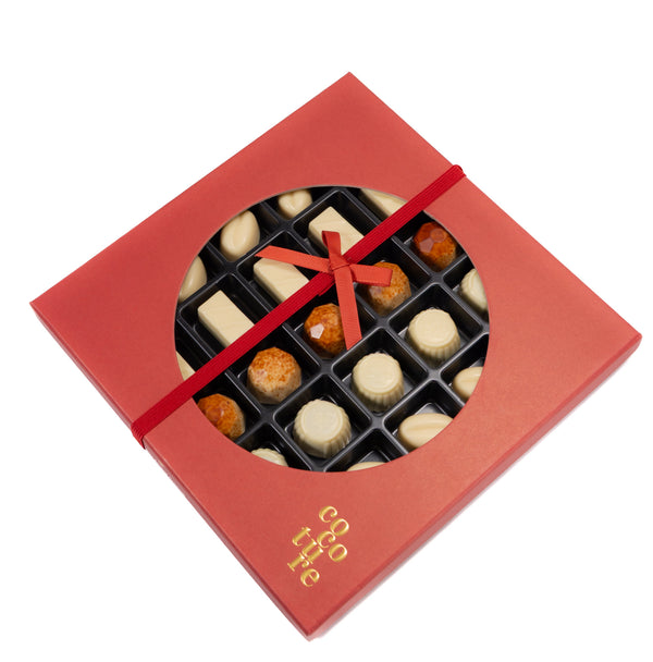 Close-up of Andy Anand sugar free white chocolate truffle pralines with smooth creamy texture