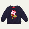Child wearing navy Mon Coeur Recycled Cotton Flower Kids Sweatshirt with relaxed fit and ribbed neckline