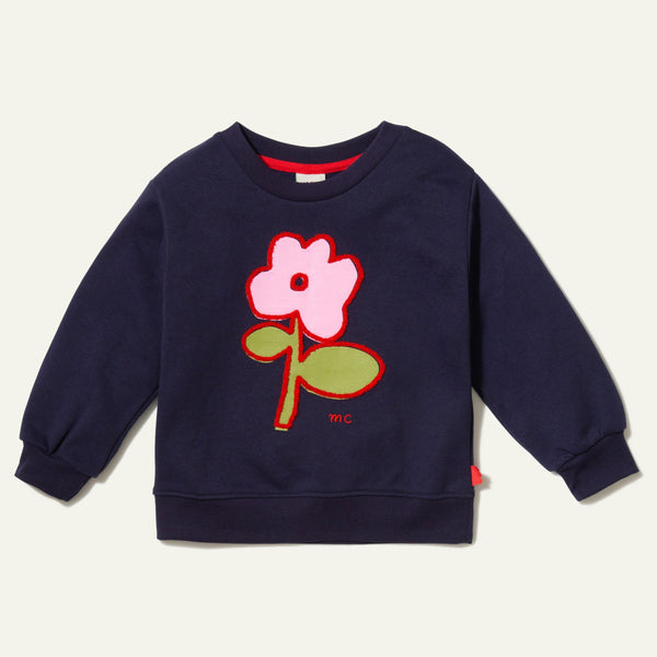 Child wearing navy Mon Coeur Recycled Cotton Flower Kids Sweatshirt with relaxed fit and ribbed neckline