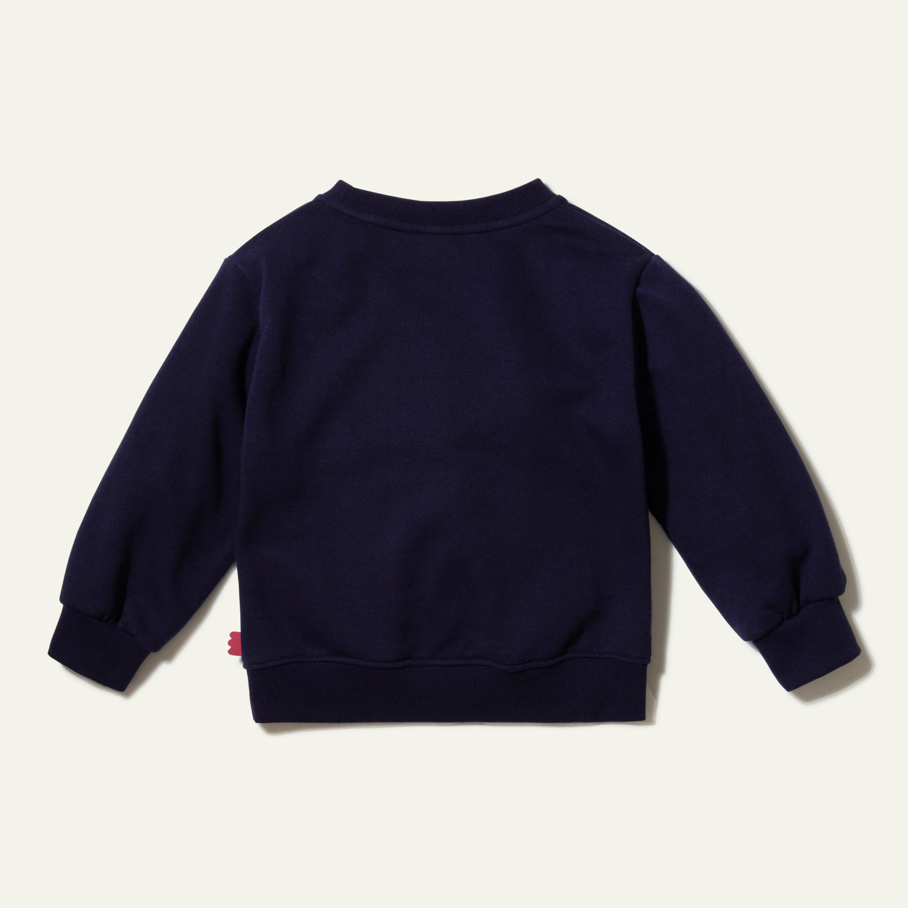 Close-up of Mon Coeur Cotton Flower Kids Sweatshirt showing ribbed cuff and recycled fabric detail