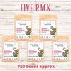 Five-pack of Flawn Seed Kits for Showy Milkweed on a wooden background