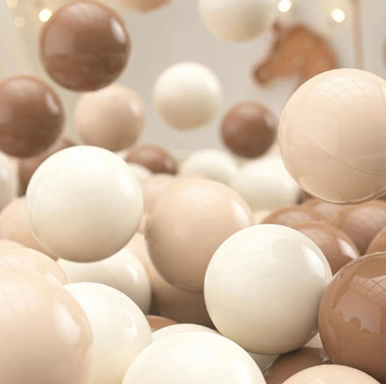 Tiny Land 200-piece BPA-free ocean ball pit balls in white, milk-tea and brown varied colors on neutral background