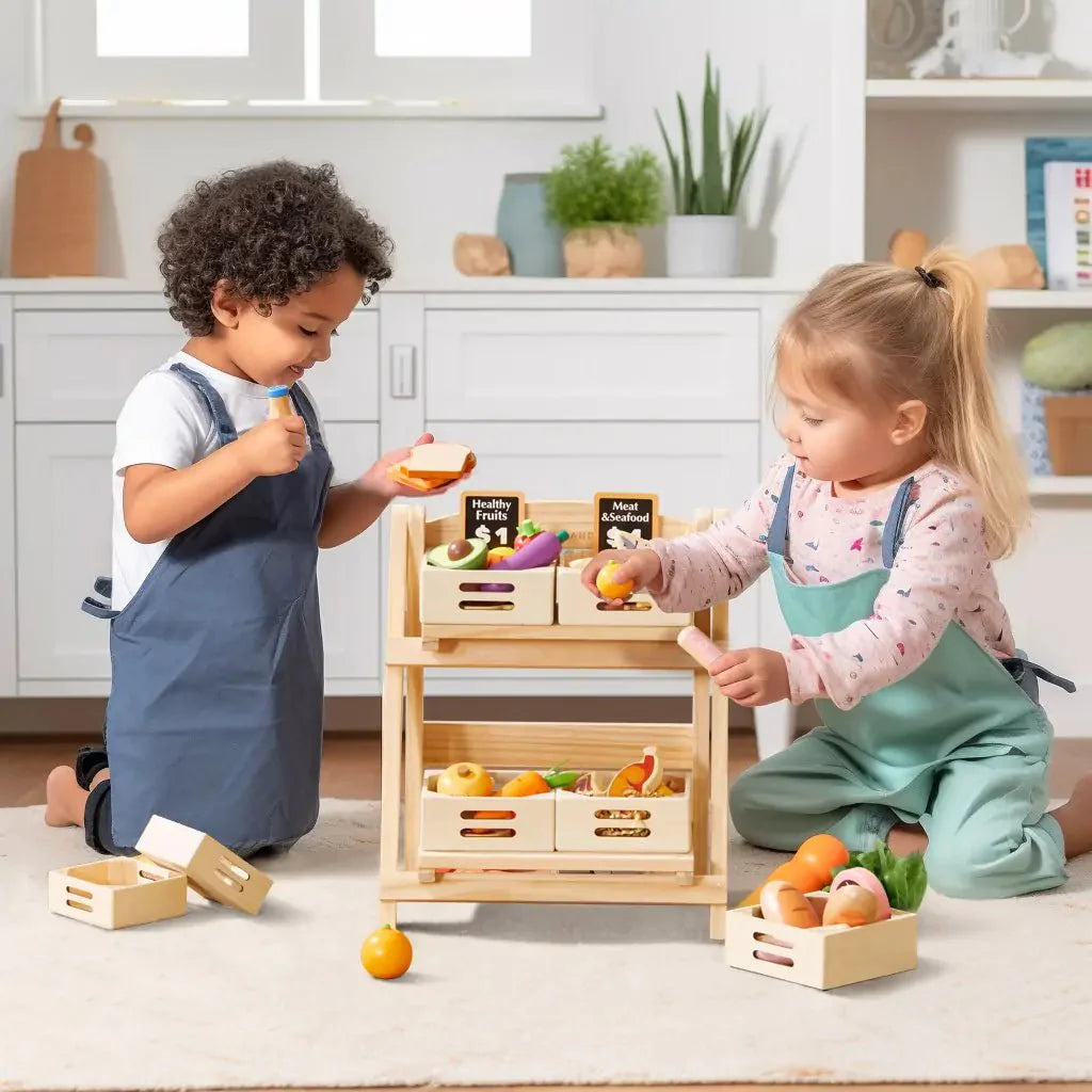 Two children playing with a wooden toy kitchen set in a bright room.