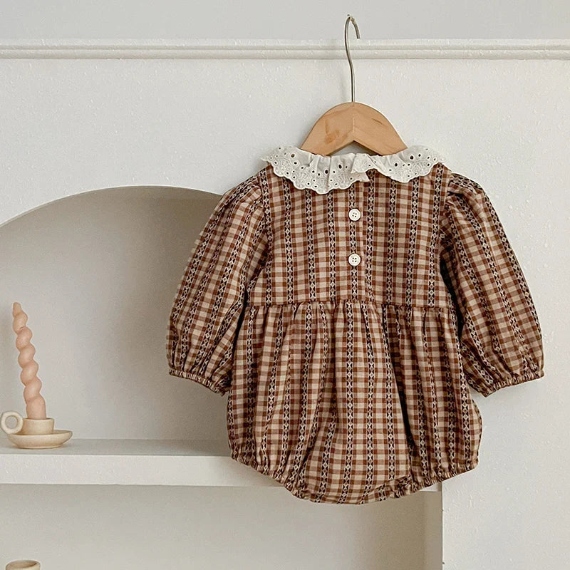 Baby wearing the Lace Collar Checkered Romper with lace collar detail