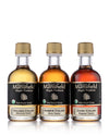 Three 50ml glass bottles of organic Vermont maple syrup in golden delicate, amber rich, and dark robust grades