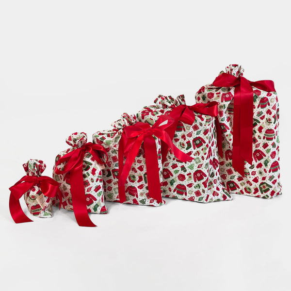 Set of decorative bags with red ribbons on a white background