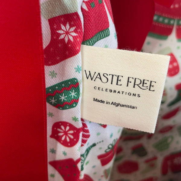 Waste Free Celebrations product with a tag on a red fabric background