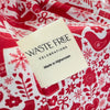 Waste Free Celebrations label on a red and white patterned fabric