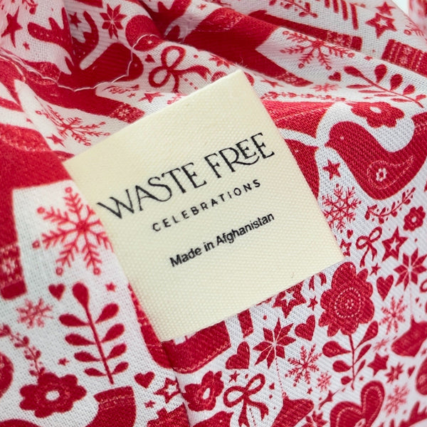 Waste Free Celebrations label on a red and white patterned fabric