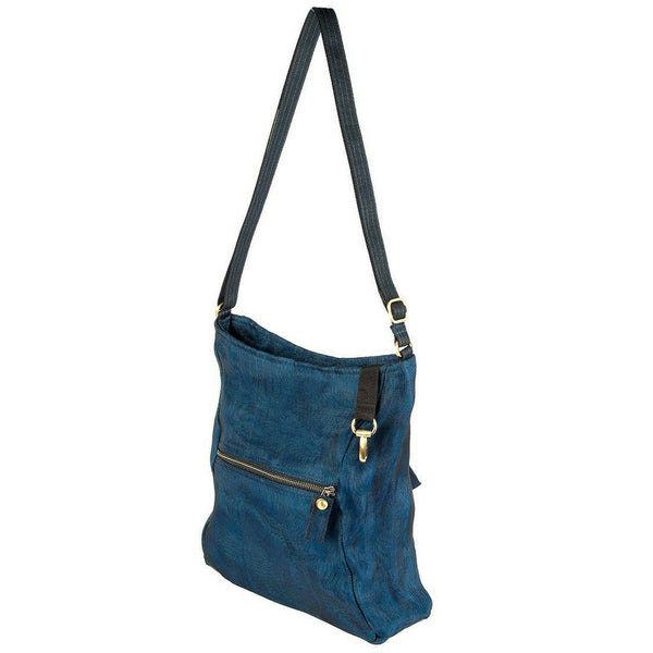 Blue shoulder bag with a strap on a white background