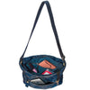 Blue denim crossbody bag with a strap on a white background