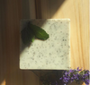 Heliotrope SF exfoliating bath bar ingredient and packaging detail – rosemary mint and chai spice natural soaps
