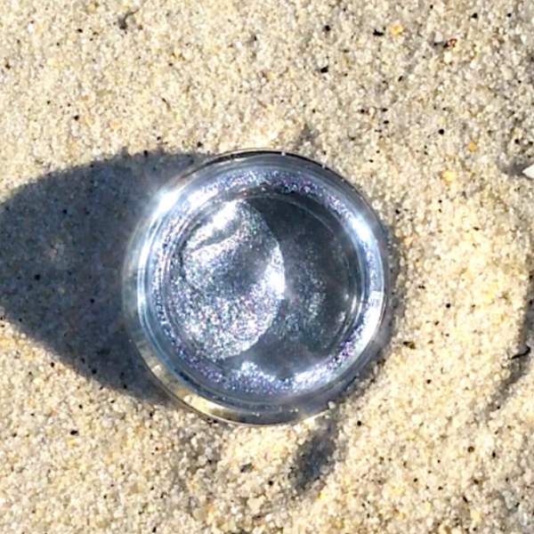 Metallic object on sandy ground