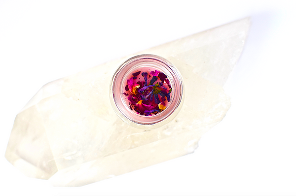 Cosmetic product with colorful applicator on a white background