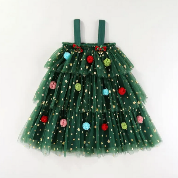A green tulle Christmas tree skirt dress for toddlers, featuring a tiered design decorated with gold sequin stars and colorful pom-pom ornaments, complete with matching green shoulder straps.