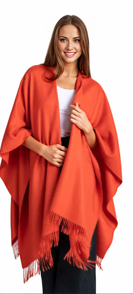 Premium Classic Solid Baby Alpaca Poncho in a rich solid colour, draped over shoulders showing full length and fringe detail