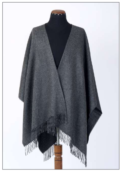 Detail shot of the handcrafted fringe finish on the Premium Baby Alpaca Poncho, made in Peru