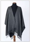 Detail shot of the handcrafted fringe finish on the Premium Baby Alpaca Poncho, made in Peru