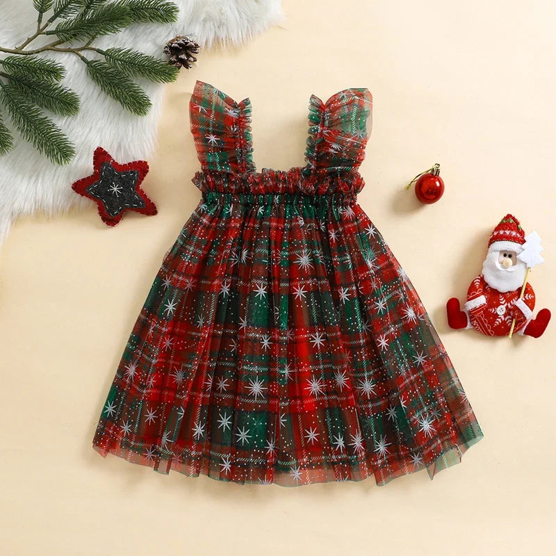 Child wearing the Christmas Layered Tulle Dress for a holiday occasion