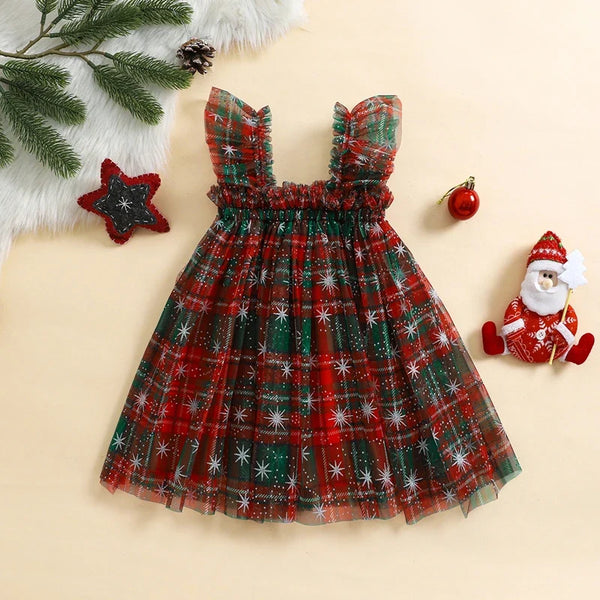 Child wearing the Christmas Layered Tulle Dress for a holiday occasion