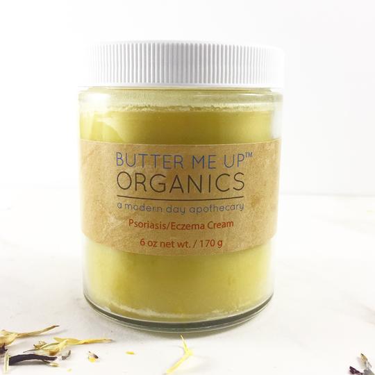 Jar of Butter Me Up Organics cream on a white background