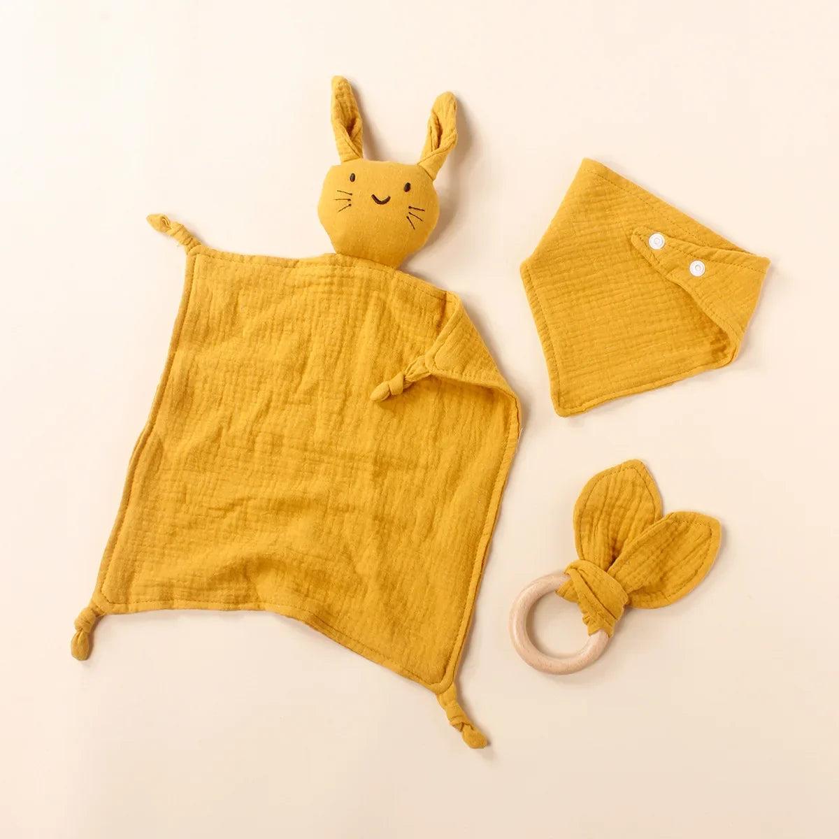 Close-up of the wooden ring on the muslin teething toy