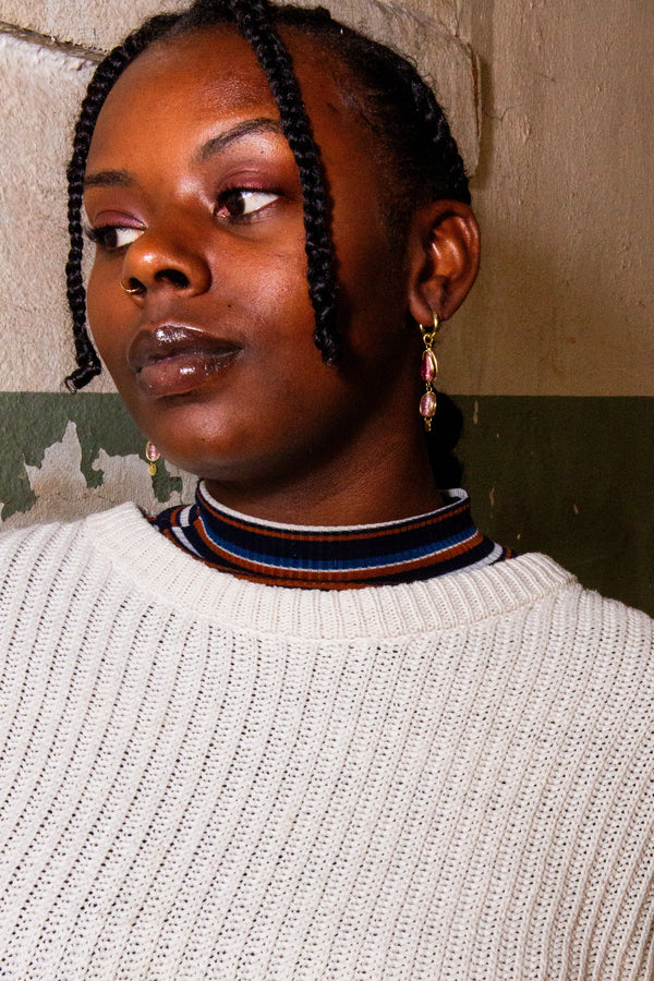 Close-up of Sherbet Glass Bead Drop Earrings showing mauve glass bead detail and gold hoop, handcrafted in India by Fair Anita