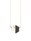 Short black hexagon necklace in black resin and silver-plated metal by Fair Anita, worn as a standalone piece
