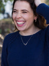 Short reindeer antler necklace by Fair Anita worn as a pendant