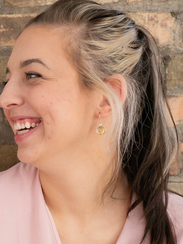 Side view of silver rutilated quartz drop earrings handcrafted by Fair Anita artisans