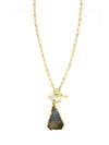 Flat lay of the Simple Luxury Labradorite Necklace by Fair Anita on a neutral background